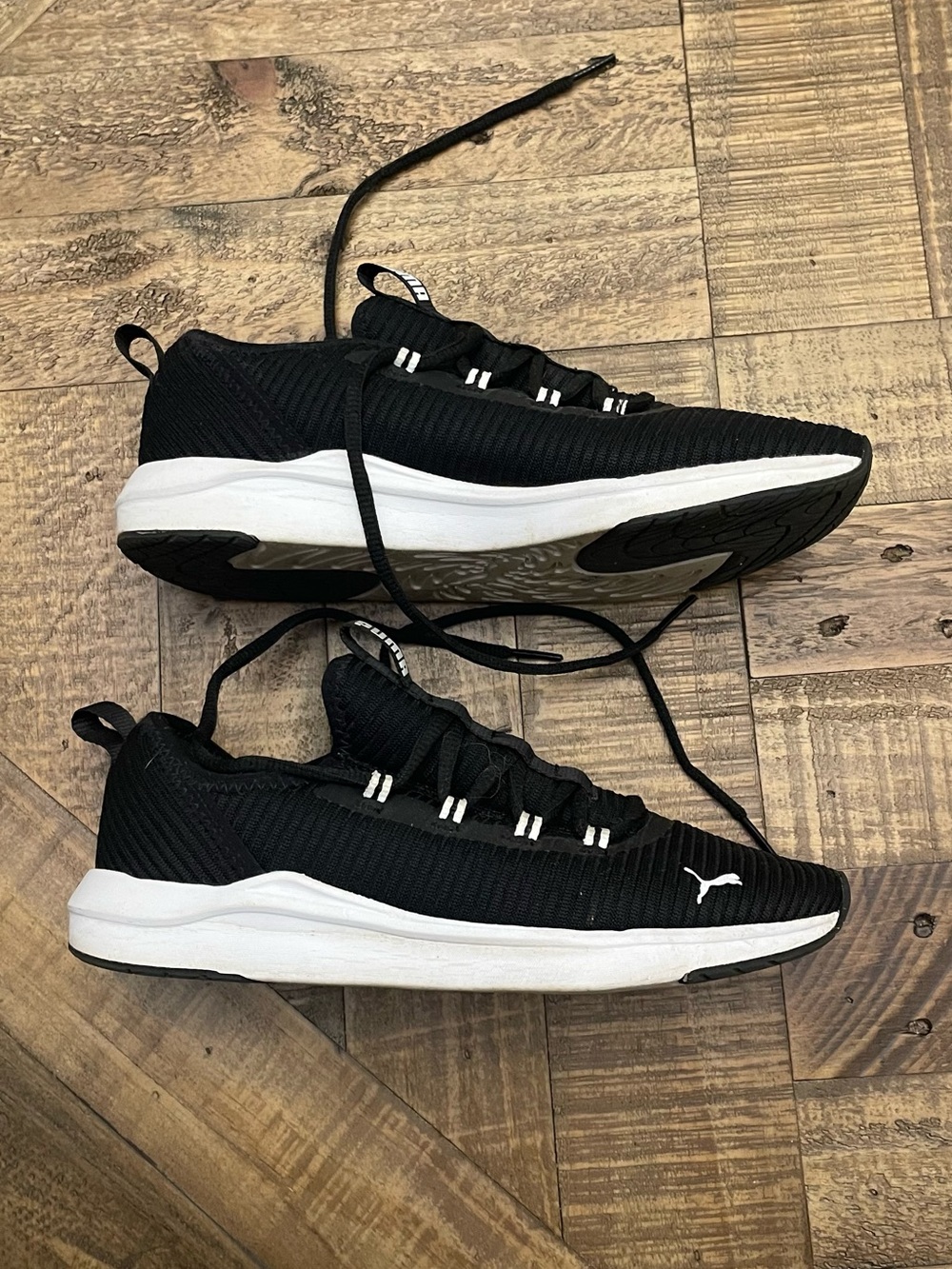 black PUMA Softride Finesse Sport running shoes with a white sole